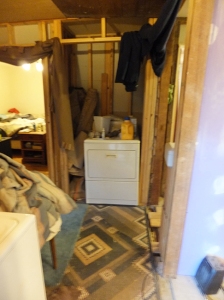 Standing in MBR, looking back at the end of the hall, washer is to my left, facing North. dryer is in hall closet, doorway to left isa mostly finished room.